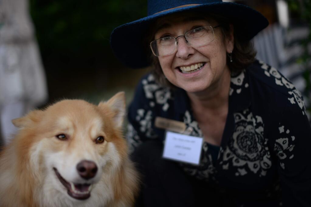 Santa Rosa City Councilwoman Julie Combs with her dog, Argos, at Wags, Whiskers & Wine Gala held at Trentadue Winery in Geyserville, California on Friday, Aug. 10, 2018. (ERIK CASTRO/ FOR THE PD)