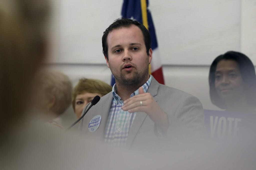 FILE - In this Aug. 29, 2014, file photo, Josh Duggar, executive director of FRC Action, speaks in favor the Pain-Capable Unborn Child Protection Act at the Arkansas state Capitol in Little Rock, Ark. Tony Perkins, president of the Washington-based Christian lobbying group, said Thursday, May 21, 2015, that he has accepted the resignation of Duggar in the wake of the reality TV star's apology for unspecified bad behavior as a young teen. (AP Photo/Danny Johnston, File)