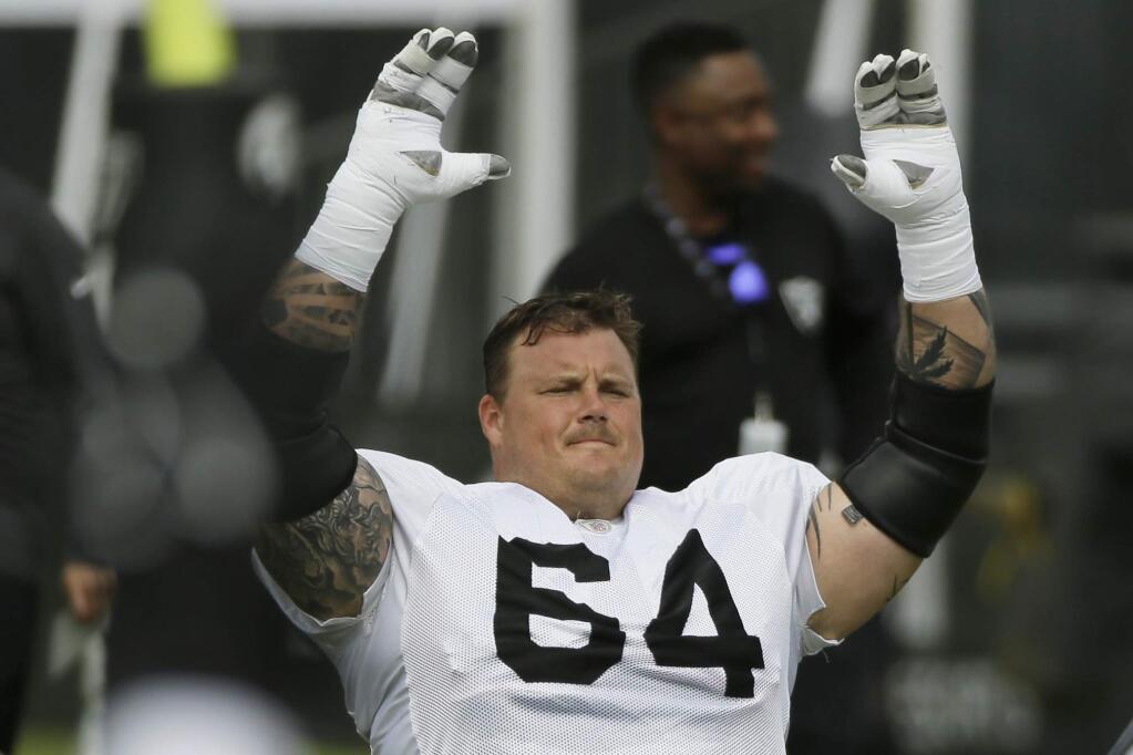 In this July 29, 2019, file photo, Oakland Raiders center Richie Incognito stretches during training camp in Napa. Incognito returns to the Raiders after missing two games for a suspension for violating the NFL's personal conduct policy. (AP Photo/Eric Risberg, File)