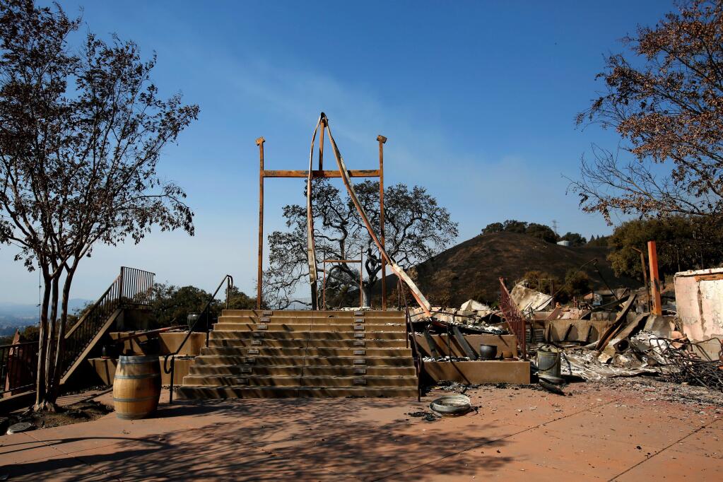 The wide set of stairs once led up to the Paradise Ridge Winery tasting room, in Santa Rosa, California, on Thursday, October 12, 2017. The winery's tasting room, wine production facility and parts of the vineyards and sculpture gardens were destroyed when the Tubbs fire swept through the area three days earlier. (Alvin Jornada / The Press Democrat)