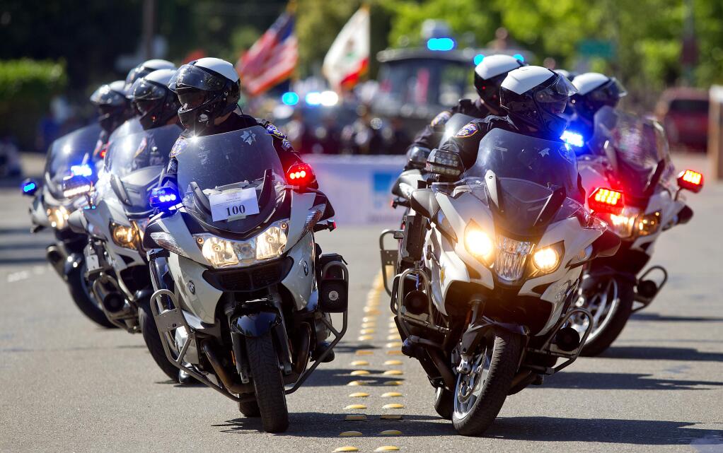 The Santa Rosa Police Department motorcycle unit rolled out for the start of the 2018 Santa Rosa Rose Parade on Saturday. (photo by John Burgess/The Press Democrat)