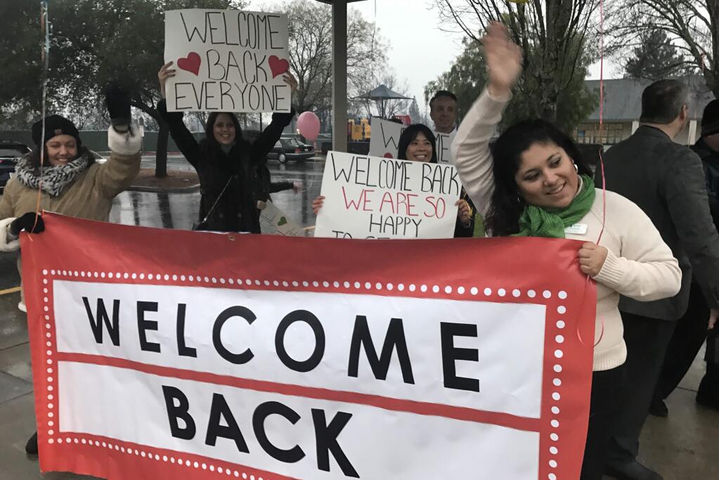Students were welcomed back to Riebli Elementary School in Santa Rosa with signs and hot chocolate on Monday, Jan. 8, 2018. (BETH SCHLANKER/ PD)