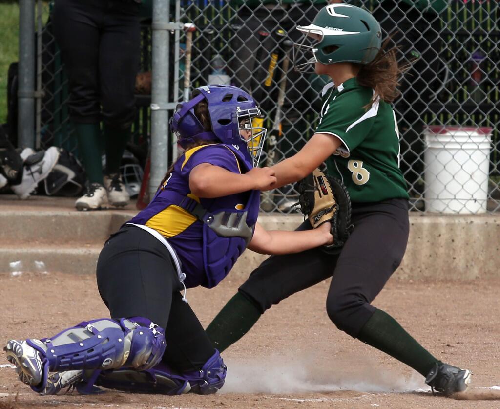 Ukiah's Kat McCoy tags out Maria Carrillo's Frannie Muchow at home during the game held at Maria Carrillo High School, Thursday, May 7, 2015. (Crista Jeremiason / The Press Democrat)