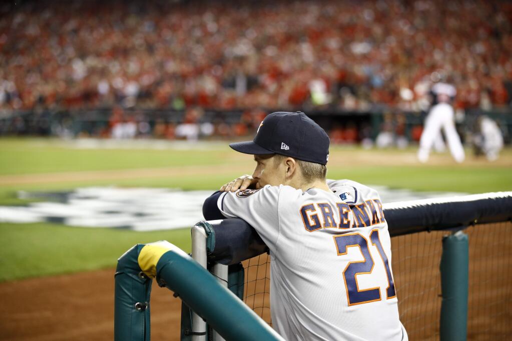 Houston Astros starting pitcher Zack Greinke watches during the sixth inning of Game 3 of the baseball World Series against the Washington Nationals Friday, Oct. 25, 2019, in Washington. (AP Photo/Patrick Semansky)