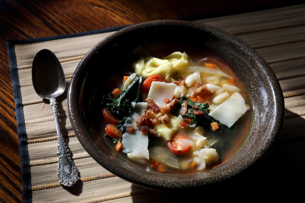 White bean and tortellini soup with kale prepared by John Ash at his home in Santa Rosa on Tuesday, Dec. 31, 2019. (BETH SCHLANKER/ The Press Democrat)