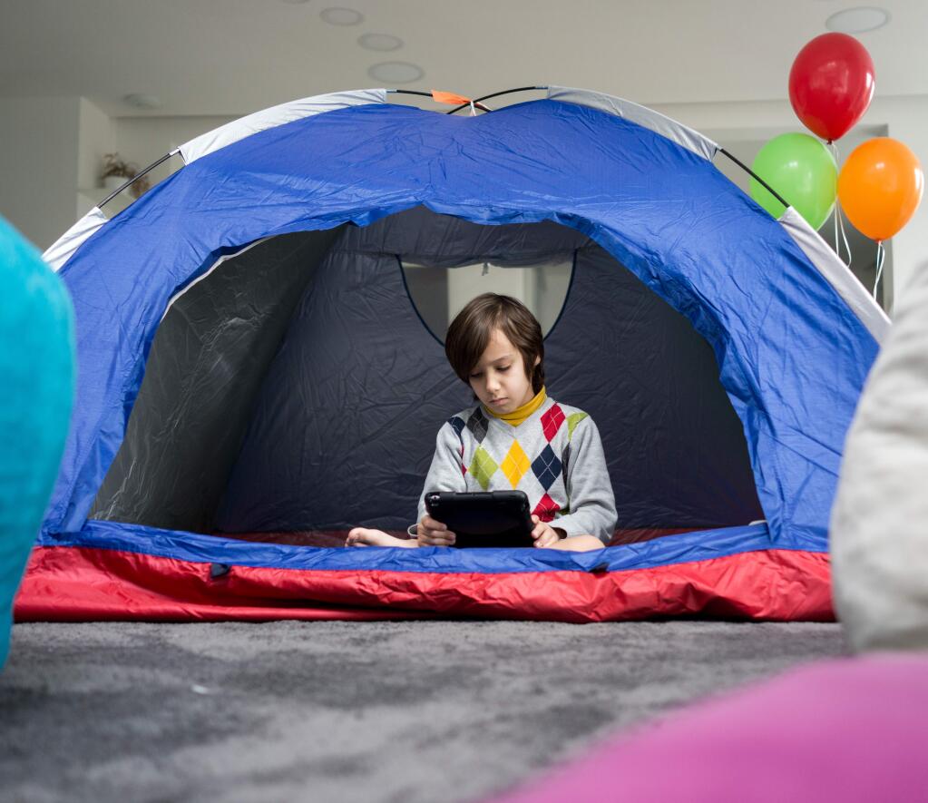 Go camping in your living room: Make an otherwise scary situation into something exciting for your kids. Set up a tent or create a blanket fort in your living room where the kids can play, sleep or watch a movie.