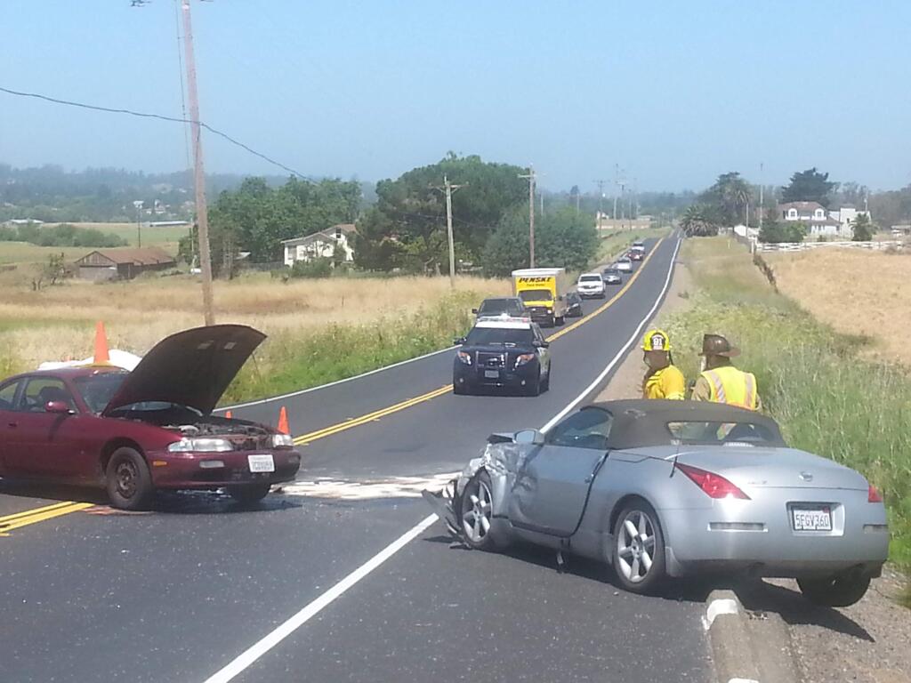 A man driving a maroon Nissan was killed and a 61-year-old woman driving a silver Nissan was hospitalized in a crash on Old Adobe Road east of Petaluma on Saturday, June 13, 2015. (ELOISA RUANO GONZALEZ/ PD)