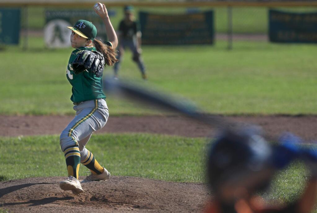 Kailee Diaz-Randall, 13, pitches against the Giants in Westside Little League's Majors division, Tuesday, June 5, 2018 in Santa Rosa. (Kent Porter / The Press Democrat) 2018