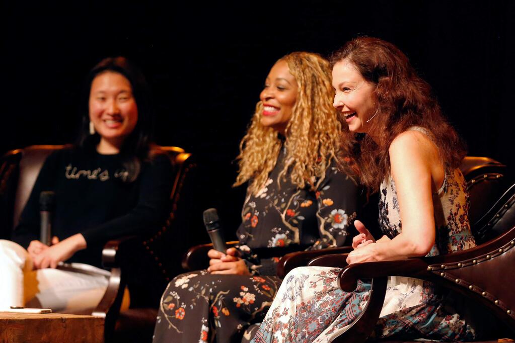 Actress Ashley Judd, right, Adama Iwu, director of government relations at Visa, and Lindsay Meyer, founder/CEO of Batch, share a laugh during the Women in Conversation speaker series at Luther Burbank Center for the Arts in Santa Rosa, California, on Tuesday, March 20, 2018. (Alvin Jornada / The Press Democrat)