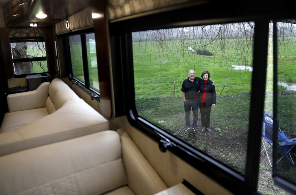 Rudy and Carol Caparros stand outside of the new motorhome they bought to live in temporaroly after their Fountaingrove home of 26 years was destroyed by fire. Photo taken at the San Francisco North/Petaluma KOA in Santa Rosa, on Thursday, Jan. 18, 2018. (BETH SCHLANKER/ The Press Democrat)