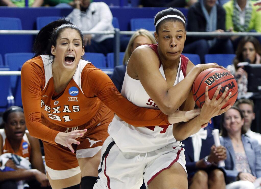 Stanford's Erica McCall, right, is pressured by Texas' Audrey-Ann Caron-Goudreau during a regional semifinal in the women's NCAA tournament in Lexington, Ky., Friday, March 24, 2017. Stanford won 77-66. (AP Photo/James Crisp)