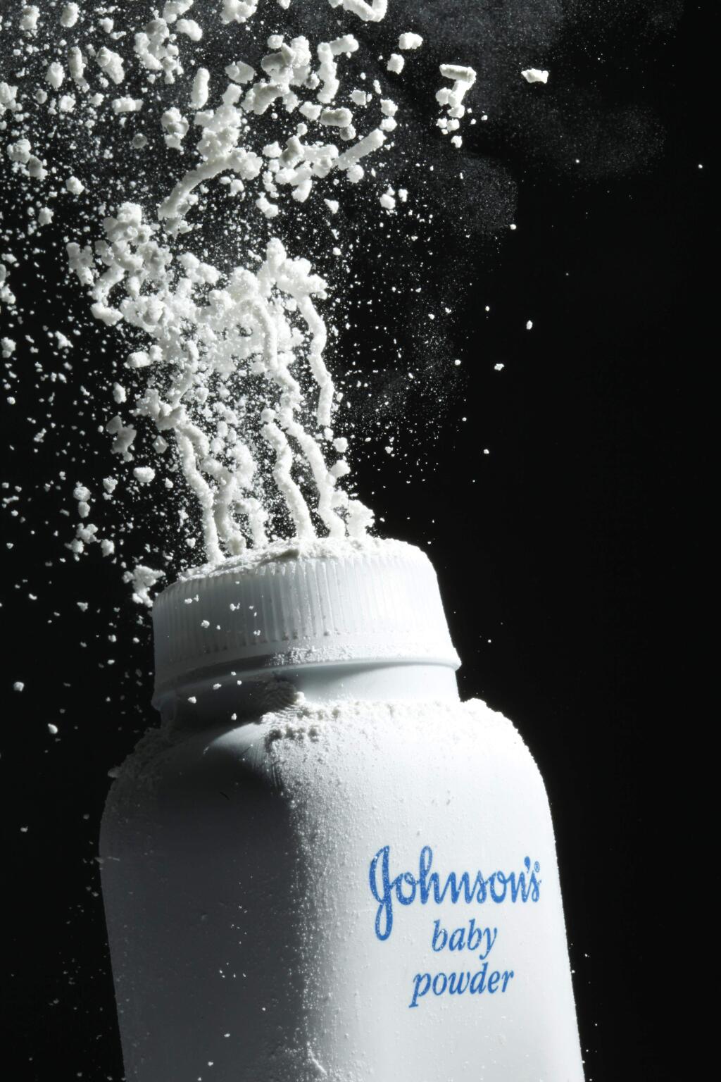 FILE - In this April 19, 2010, file photo, Johnson's baby powder is squeezed from its container. On Monday, Aug. 21, 2017, a Los Angeles County Superior Court spokeswoman confirmed that a jury has ordered Johnson & Johnson to pay $417 million in a case to a woman who claimed in a lawsuit that the talc in the company's iconic baby powder causes ovarian cancer when applied regularly for feminine hygiene. (AP Photo/Matt Rourke, File)