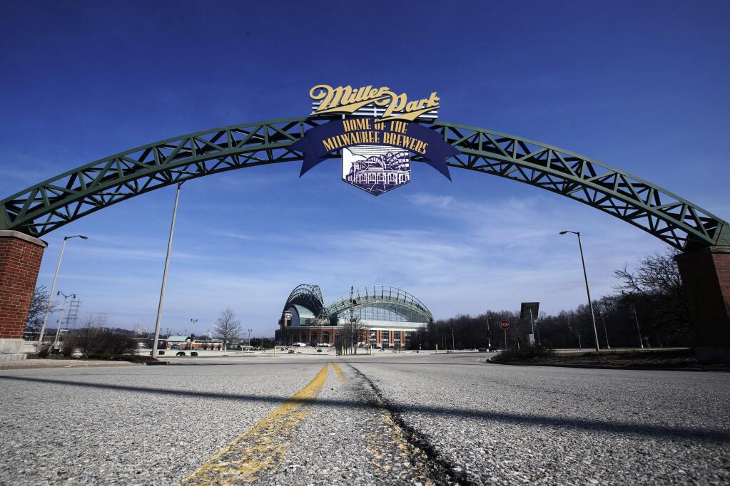 In this March 24, 2020, file photo, Miller Park is seen in Milwaukee. The Brewers were supposed to host opening day on Thursday, March 26, but the season start was postponed by Major League Baseball because of the coronavirus pandemic. (AP Photo/Morry Gash, File)