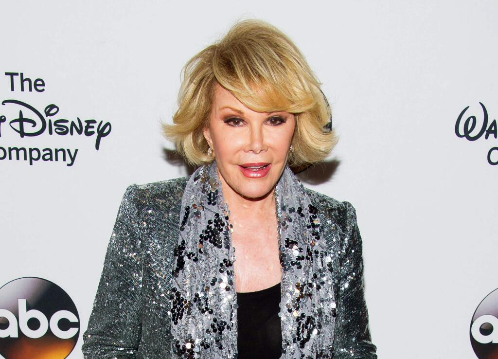 In this May 14, 2014 file photo, TV personality Joan Rivers attends 'A Celebration of Barbara Walters' in New York. Melissa Rivers announced Thursday, Sept. 4, that her mother Joan died Thursday, in New York. (Photo by Charles Sykes/Invision/AP, File)