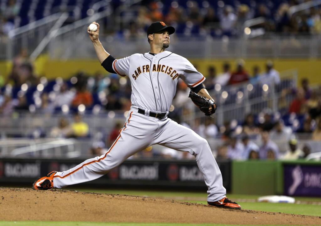 San Francisco Giants' Ryan Vogelsong delivers a pitch during the first inning of a baseball game against the Miami Marlins, Tuesday, June 30, 2015, in Miami. (AP Photo/Wilfredo Lee)