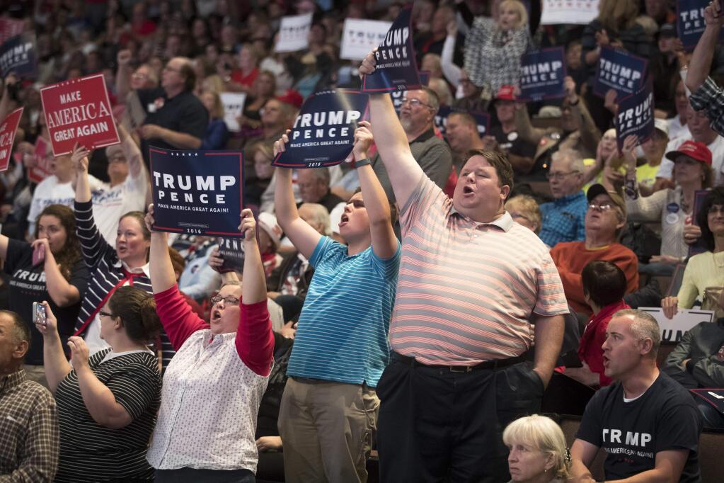 Supporters of Republican presidential candidate Donald Trump cheer during a campaign rally, Thursday, Oct. 13, 2016, in Cincinnati. (AP Photo/John Minchillo)