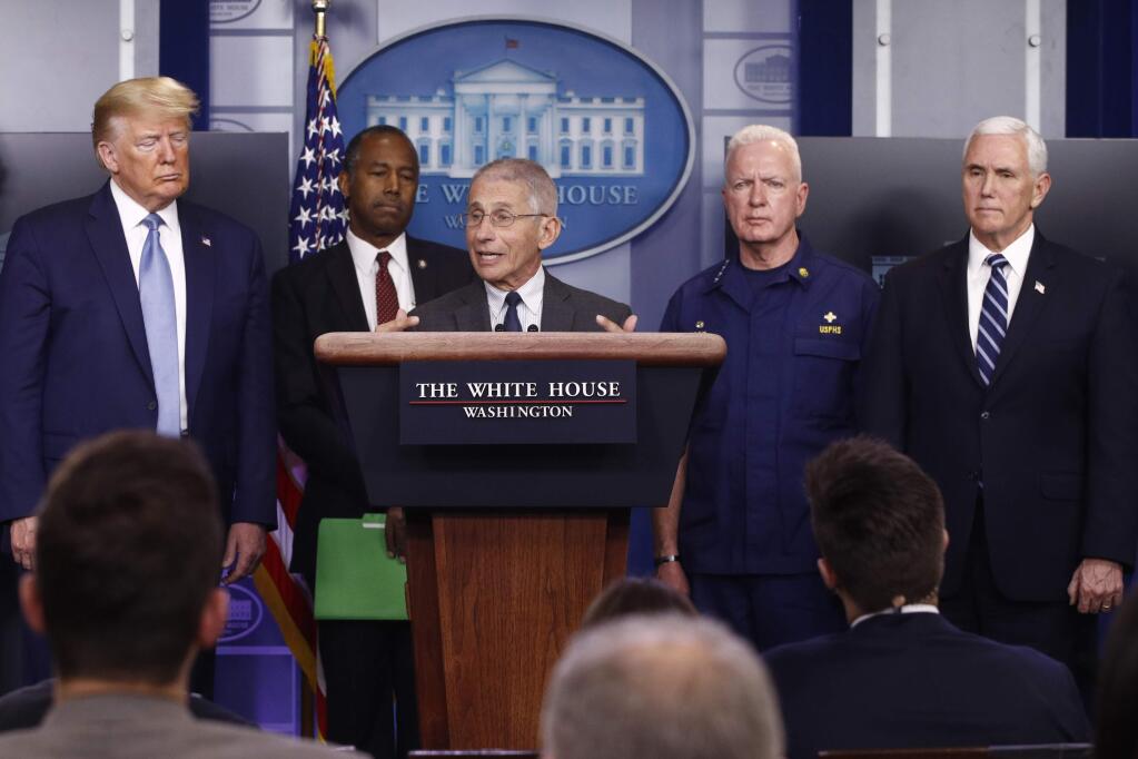 Director of the National Institute of Allergy and Infectious Diseases Dr. Anthony Fauci speaks during a coronavirus task force briefing at the White House, Saturday, March 21, 2020, in Washington. From left, President Donald Trump, Housing and Urban Development Secretary Ben Carson, Fauci, Adm. Brett Giroir, assistant secretary for health, and Vice President Mike Pence. (AP Photo/Patrick Semansky)