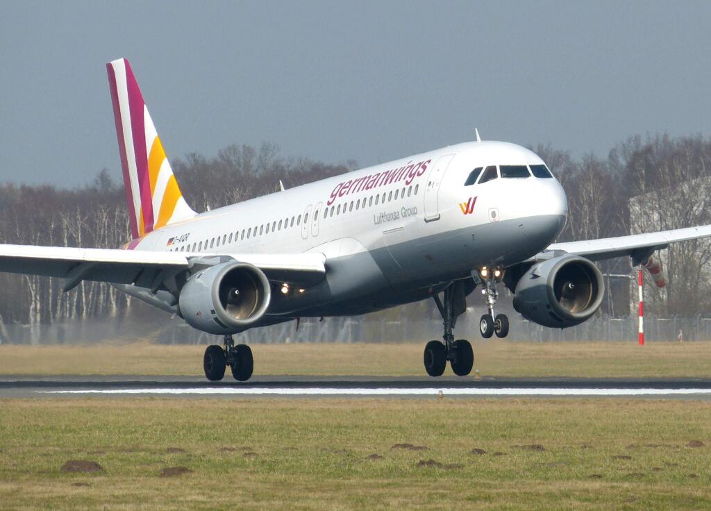 The March 7, 2014 photo shows an Airbus A320 of German airline Germanwings as it lands at the airport in Hamburg, northern Germany. A Germanwings passenger jet carrying 148 people crashed in the French Alps region as it traveled from Barcelona to Duesseldorf Tuesday, March 24, 2015. (AP Photo/dpa, Jan-Arwed Richter)