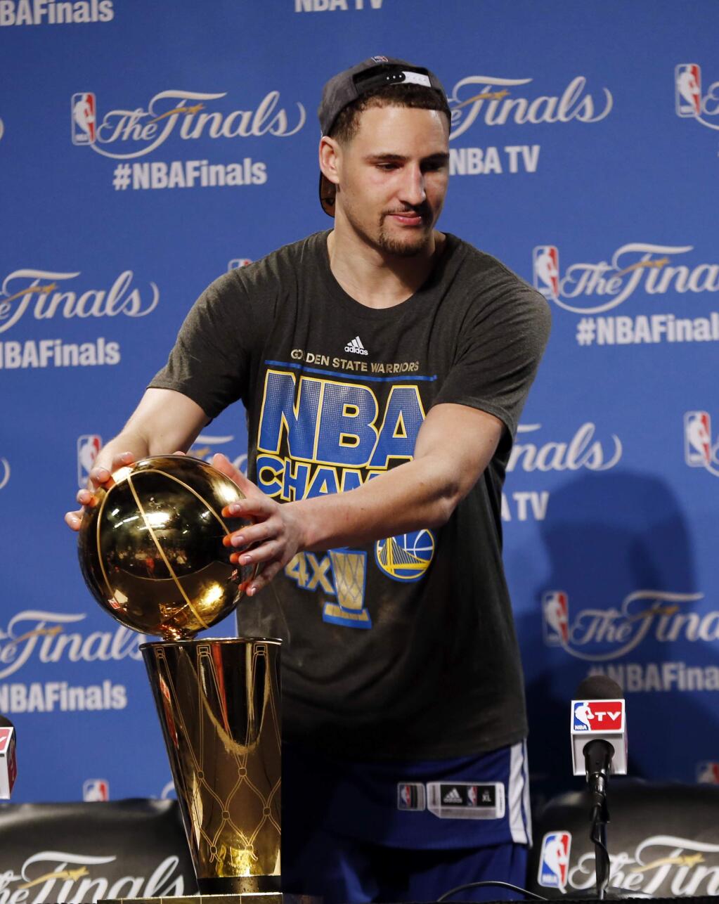 Golden State Warriors guard Klay Thompson (11) responds to a question during a news conference following Game 6 of basketball's NBA Finals against the Cleveland Cavaliers, in Cleveland, Wednesday, June 17, 2015. The Warriors defeated the Cavaliers 105-97 to win the best-of-seven game series 4-2. . (AP Photo/Paul Sancya)