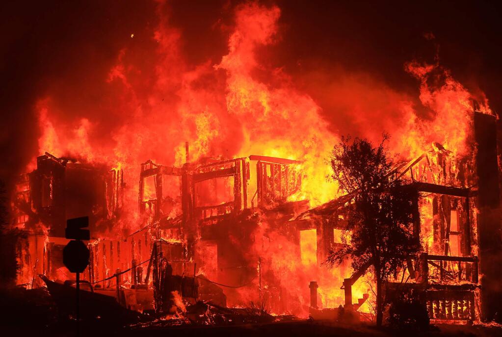 The home of Judy Morris burns the night of the Tubbs fire on Cross Creek Court in Fountaingrove, Monday Oct. 9, 2017. (Kent Porter / The Press Democrat) 2018