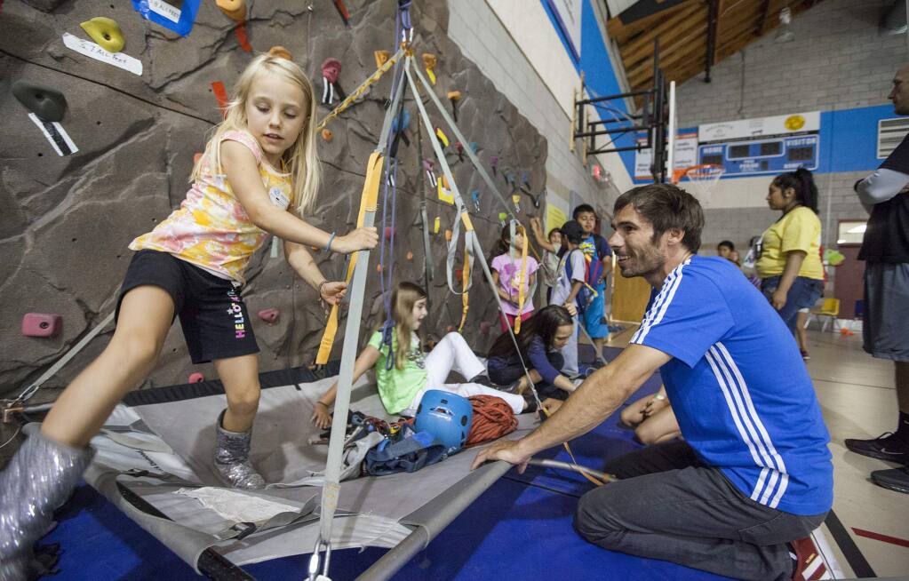 Kevin Jorgeson, who recently completed a historic ascent of El Capitan's Dawn Wall in Yosemite National Park, visited the Boys and Girls Clubs of Sonoma Valley in June, 2015. Club members were invited to experience the PortaLedge, a system designed for sleeping thousand of feet off the ground. (Photos by Robbi Pengelly/Index-Tribune)