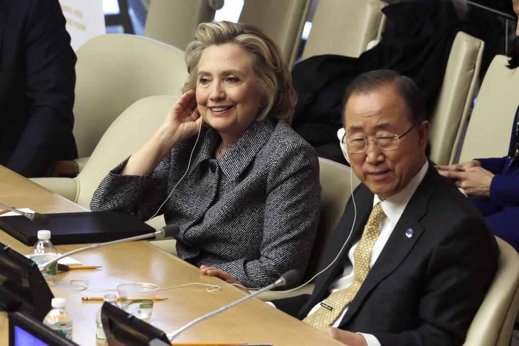 Hillary Rodham Clinton and U.N. Secretary General Ban Ki-moon listen to speeches in the ECOSOC chamber of the United Nations, during the annual Womens Empowerment Principles event, Tuesday, March 10, 2015. (AP Photo/Richard Drew)