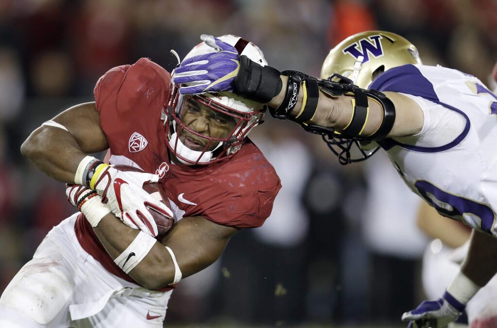 In this Nov. 10, 2017, file photo, Stanford running back Bryce Love, left, carries the ball as Washington linebacker Connor O'Brien attempts to tackle him during the first half in Stanford. (AP Photo/Marcio Jose Sanchez, File)