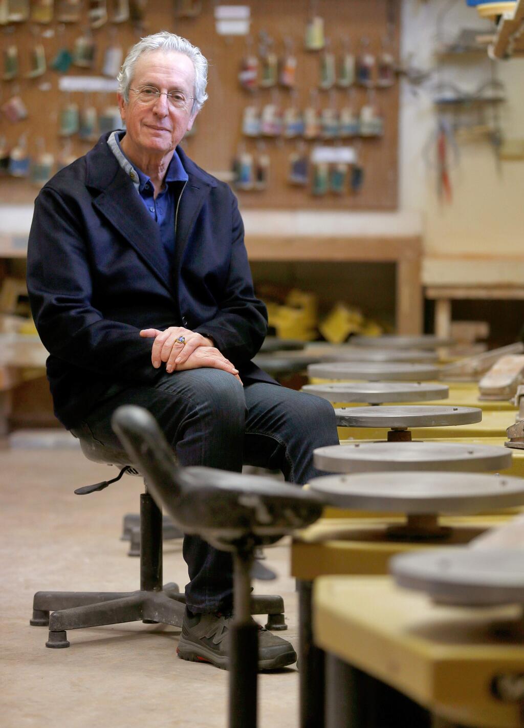 Robert Brent, board member of Sebastopol Center for the Arts and inventor of the Brent Pottery Wheel, poses for a portrait beside a row of his invention at Sebastopol Center for the Arts, in Sebastopol, California on Friday, January 5, 2018. (Alvin Jornada / The Press Democrat)