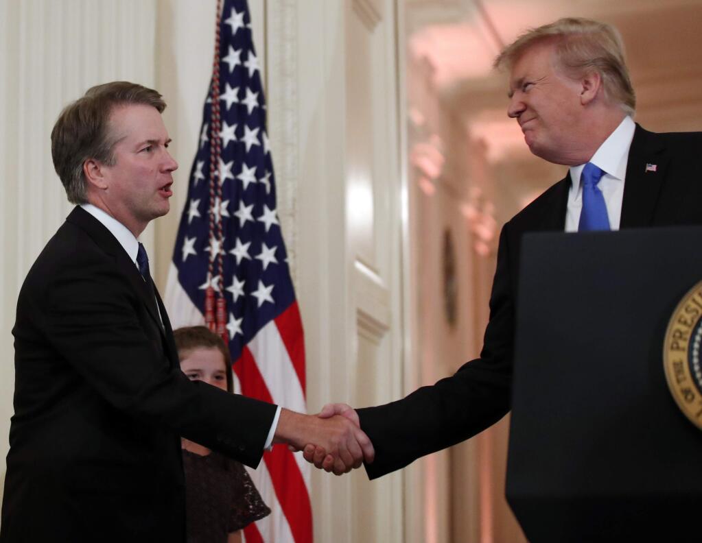 President Donald Trump shakes hands with Judge Brett Kavanaugh his Supreme Court nominee, in the East Room of the White House, Monday, July 9, 2018, in Washington. (AP Photo/Alex Brandon)