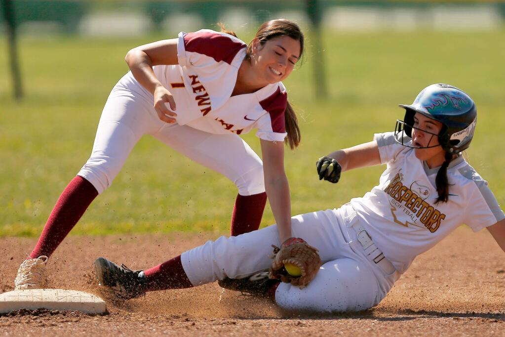 Cardinal Newman's Caroline Courier, left, tags out Piner's Lily Jareck as she slides into second base during a game in Santa Rosa on Thursday, May 2, 2019. (Alvin Jornada / The Press Democrat)