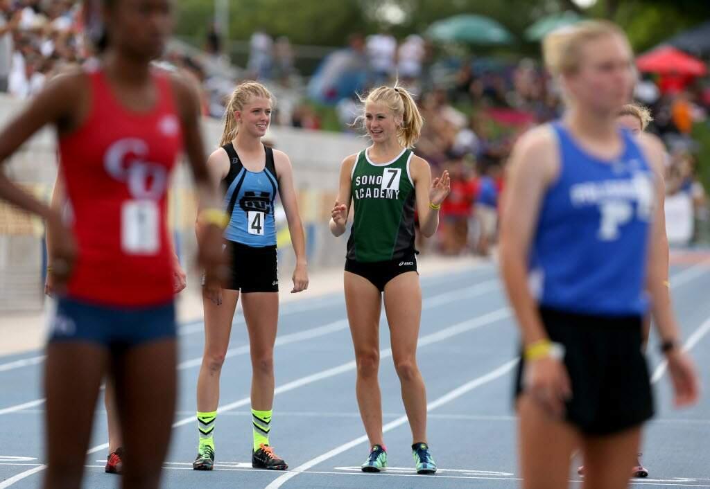 Sonoma Academy's Rylee Bowen, second from right, chats with Clovis North's Lauren Moffett, second from left, before the start of the girls 1,600-meter run during the 2015 CIF Track & Field Championships. (Crista Jeremiason/ The Press Democrat)