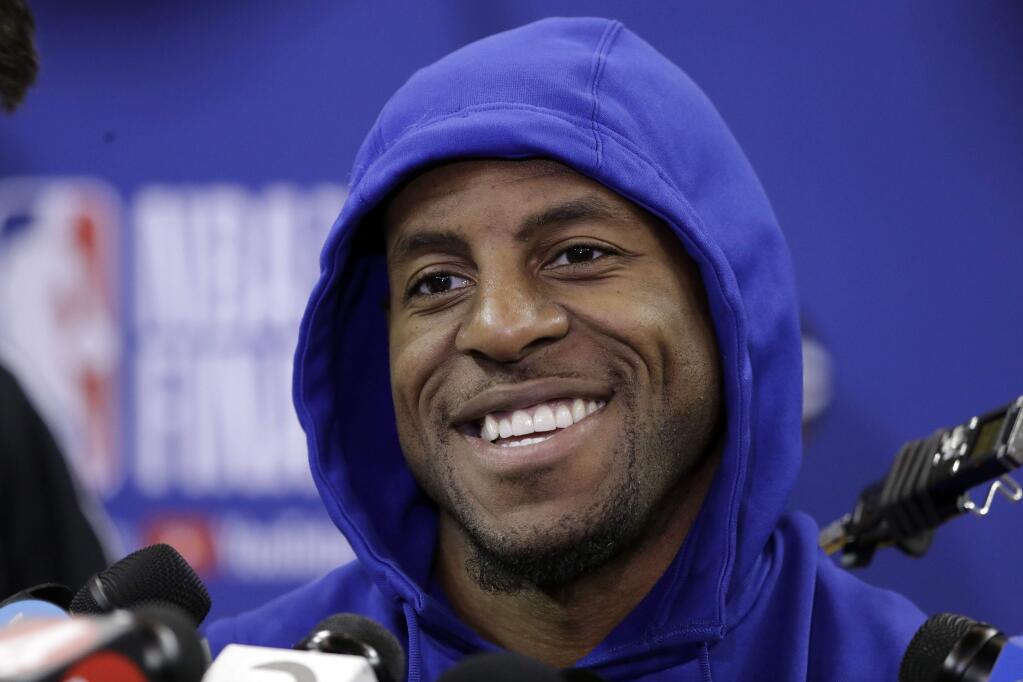 Golden State Warriors' Andre Iguodala smiles as he answers questions after practice Wednesday, May 30, 2018, in Oakland. (AP Photo/Marcio Jose Sanchez)