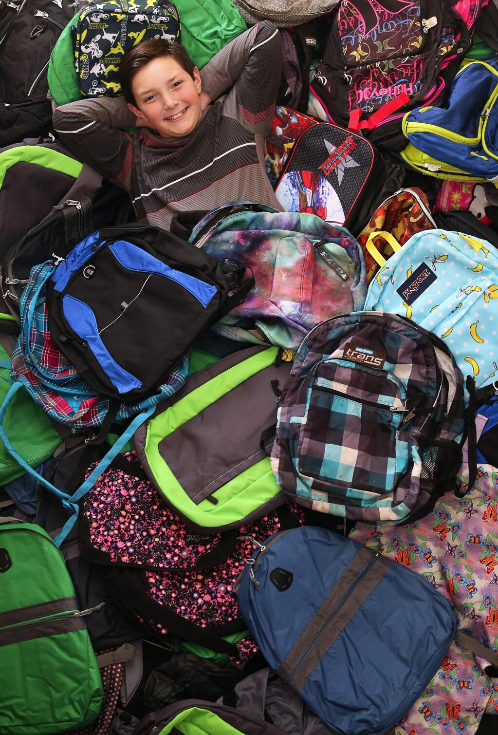 Ryan Caparros, 11, visited Costa Rica and promised to send 50 backpacks to needy schoolchildren. A collection drive he started at school garnered 350 backpacks. Unfortunately, 300 were stolen. After restarting the effort, Ryan is back up to 180 backpacks, in addition to donated money. His new goal is to send 400 backpacks to the Costa Rican schoolchildren.(Christopher Chung/ The Press Democrat)