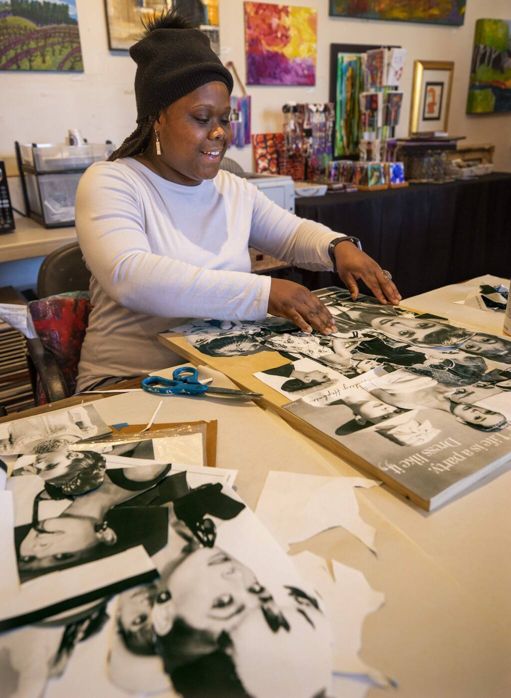 Collage artist Frances Reese creates an Audrey Hepburn piece because she likes icons. Reese likes experimenting with new art styles she finds on YouTube at the Becoming Independent Professional Art Program in the Fulton Crossing Galleries in Santa Rosa. (photo by John Burgess/The Press Democrat)
