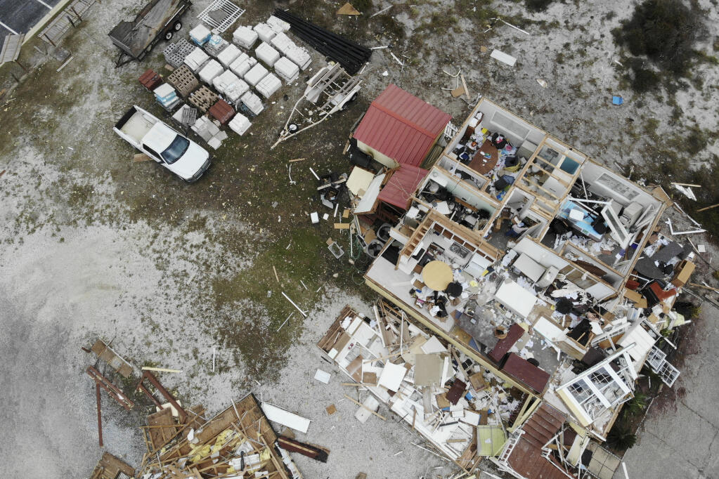 A damaged business is seen in the aftermath of Hurricane Sally, Thursday, Sept. 17, 2020, in Perdido Key, Fla.  (AP Photo/Angie Wang)