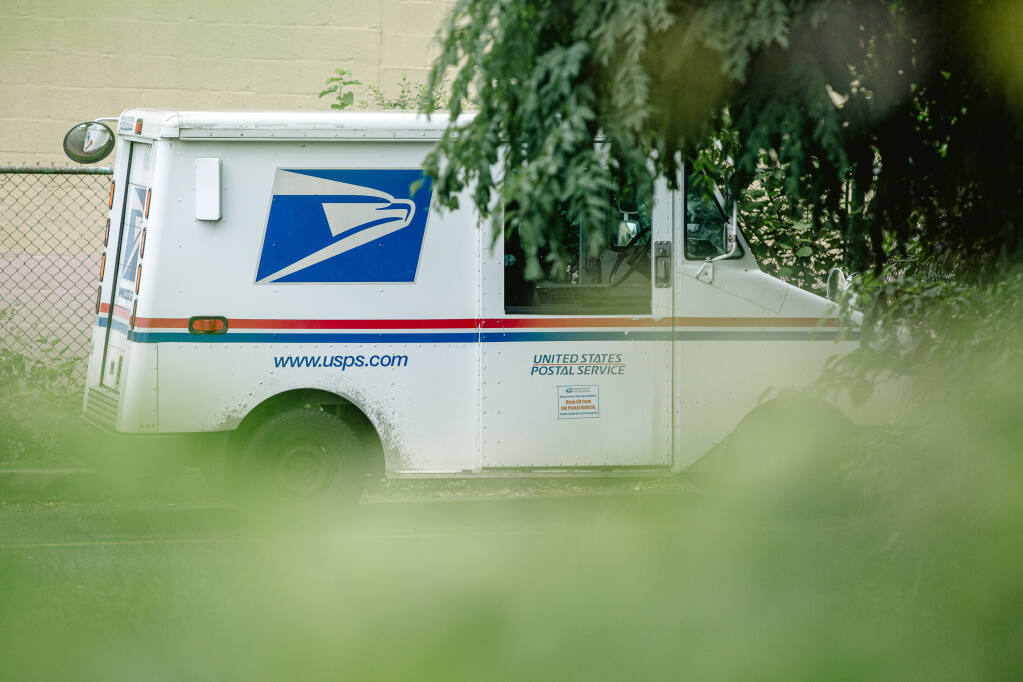 A mail delivery truck is parked outside the a post office in Darby, Pa., Thursday, Aug. 13, 2020. (Michelle Gustafson/The New York Times)