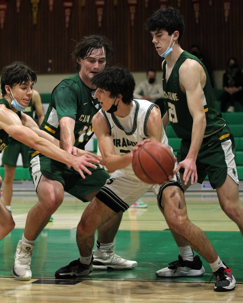 Sonoma Valley's Dom Girish (20) passes the ball around Casa Grande's defense in the third quarter of basketball at Sonoma Valley High School, in Sonoma, Calif., on Thursday, January 20, 2022. (Photo by Darryl Bush / For The Press Democrat)