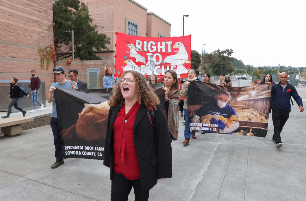 Zoe Rosenberg leads other protesters in a march in front of the Sonoma County Main Adult Detention Facility following a guilty verdict in the trial of Wayne Hsiung, in Santa Rosa on Thursday, November 2, 2023.  (Christopher Chung/The Press Democrat)