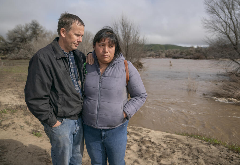 Brian and Lindsy Doan have been searching for their son Kyle who lost the grip of his mother’s hand and was swept away after their SUV was submerged by floodwaters on Jan. 9.  (LiPo Ching for Bay Area News Group)