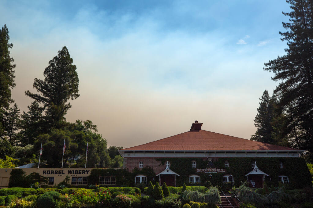 Smoke from the Walbridge fire rises above Korbel Champagne Cellars in Guerneville, California, on Wednesday, Aug.19, 2020. (Alvin A.H. Jornada / The Press Democrat)