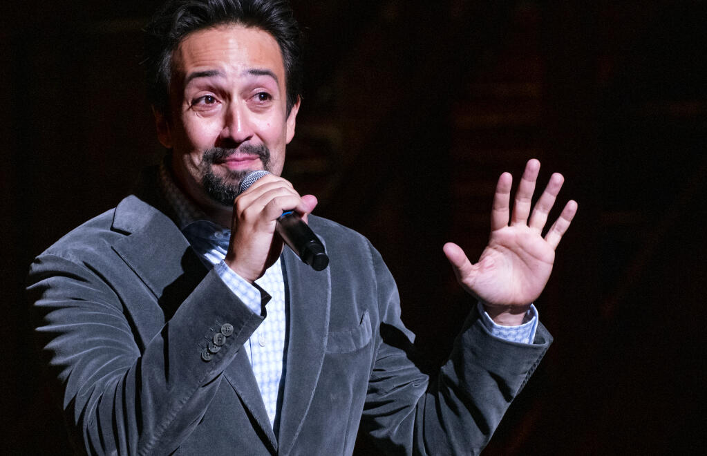 "Hamilton!" creator Lin-Manuel Miranda gives a curtain speech at the Richard Rodgers Theatre as the show opened Tuesday, Sept. 14, 2021, after being closed in early 2020 due to COVID-19 concerns. (AP Photo/Craig Ruttle)