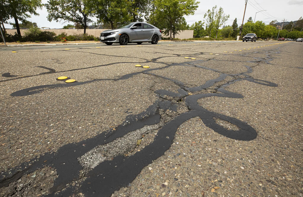 Bad road conditions on Calistoga Road near Maria Carrillo High School in Santa Rosa Friday, June 3, 2022.  (John Burgess / The Press Democrat)