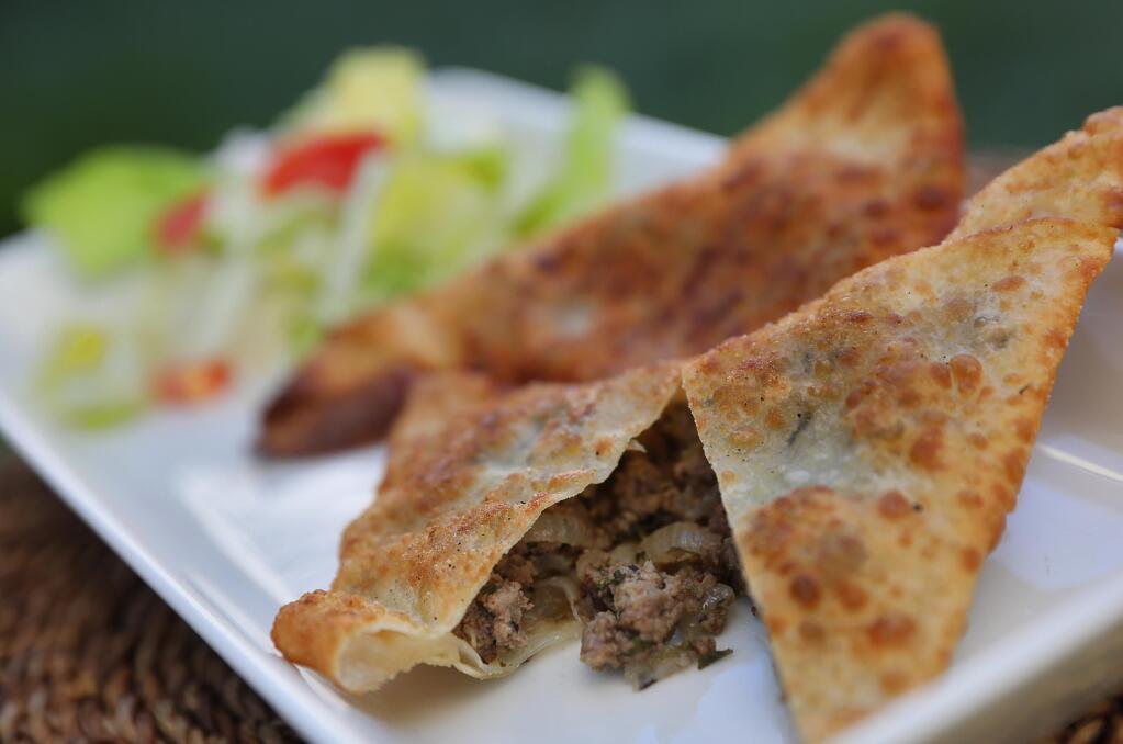 Choose from ground beef, onion and parsley or whole lentil, onion and green pepper sambusas as an appetizer at Abyssinia. (Christopher Chung/The Press Democrat)