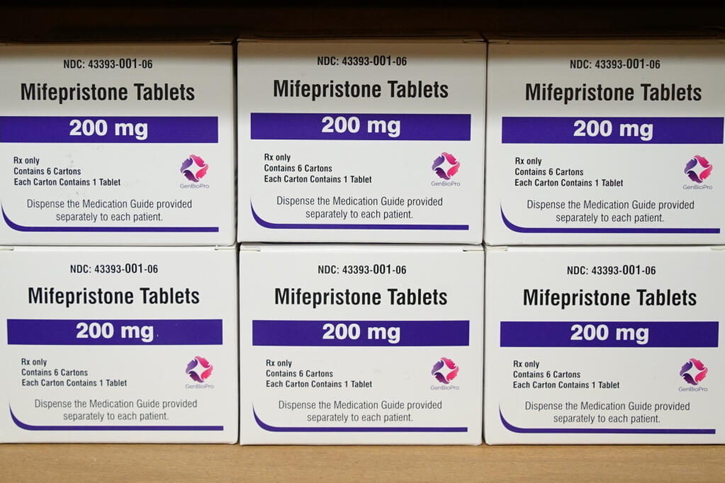 FILE - Boxes of the drug mifepristone sit on a shelf at the West Alabama Women's Center in Tuscaloosa, Ala., on March 16, 2022. Walgreens said Thursday, March 2, 2023, that it will not start selling mifepristone, an abortion pill, in 20 states that had warned of legal consequences if it did that. (AP Photo/Allen G. Breed, File)