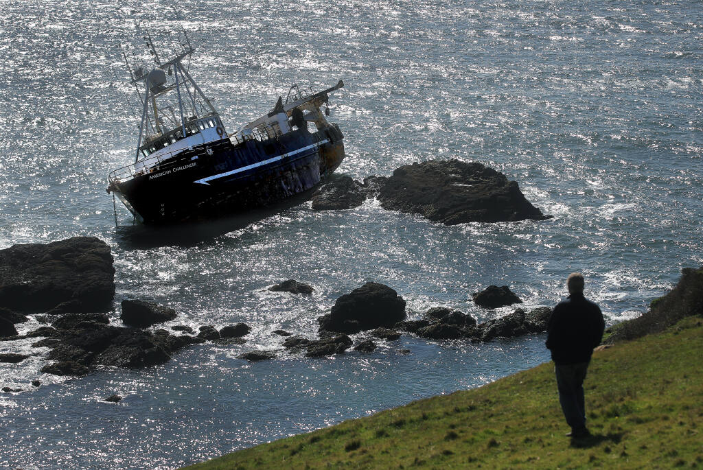 A land owner who wished to not be identified, views the American Challenger shipwreck from the bluffs near Valley Ford, Friday, March 12, 2021. (Kent Porter / The Press Democrat) 2021