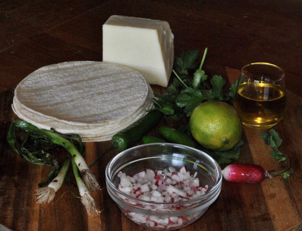 Make a Radish Salsa from radishes,  serrano peppers, garlic, lime, cilantro and olive oil.  (Gina Jordan)