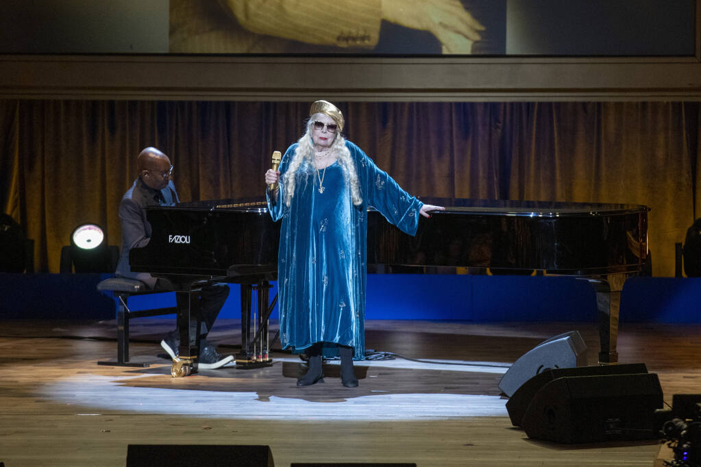 Joni Mitchell performs at the presentation of the Gershwin Prize, which honors a musician's lifetime contribution to popular music, hosted at DAR Constitution Hall in Washington on Wednesday, March 1, 2023. She is this year's winner. (AP Photo/Amanda Andrade-Rhoades)