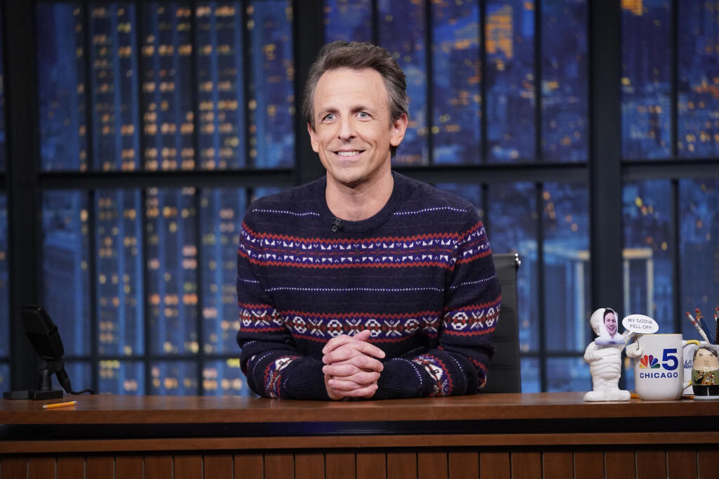 This image was released by NBC shows Seth Meyers on "Late Night With Seth Meyers" in New York on Dec. 16, 2021. (Lloyd Bishop/NBC via AP)
