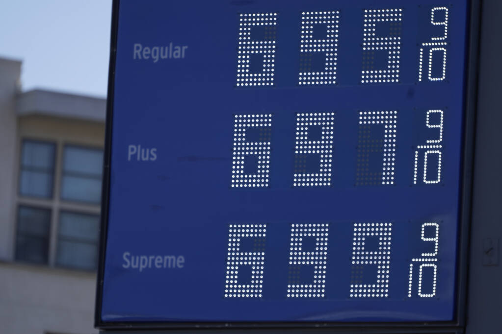High gas prices are posted at a gas station in downtown Los Angeles, Monday, March 7, 2022. (AP Photo/Damian Dovarganes)