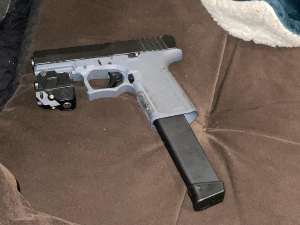 A gun with an extended magazine detectives discovered during a search of the Santa Rosa apartment. (Santa Rosa Police Department)
